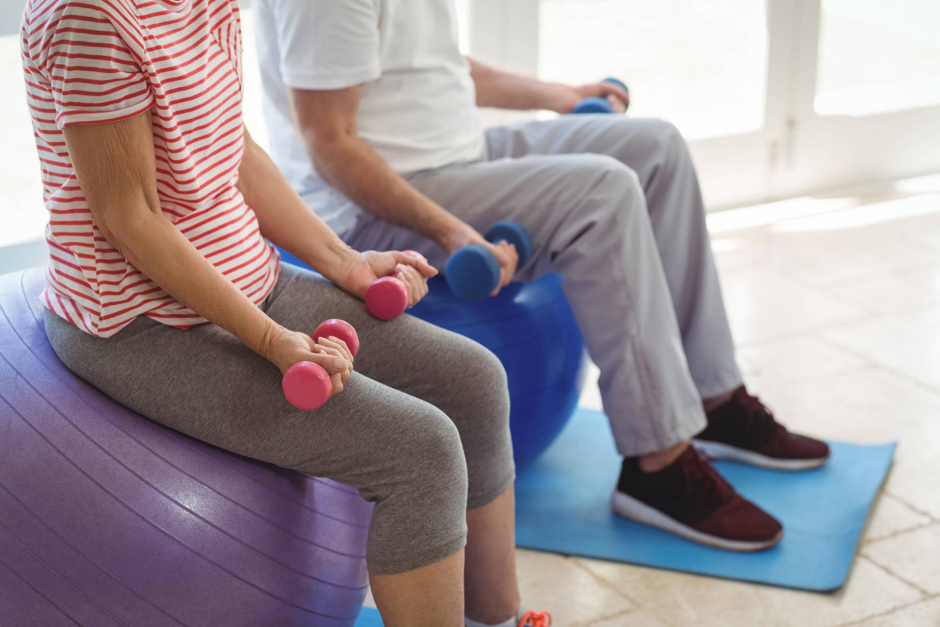 senior-couple-exercising-with-dumbbells-on-exercis-2021-08-28-16-44-40-utc (1).jpg